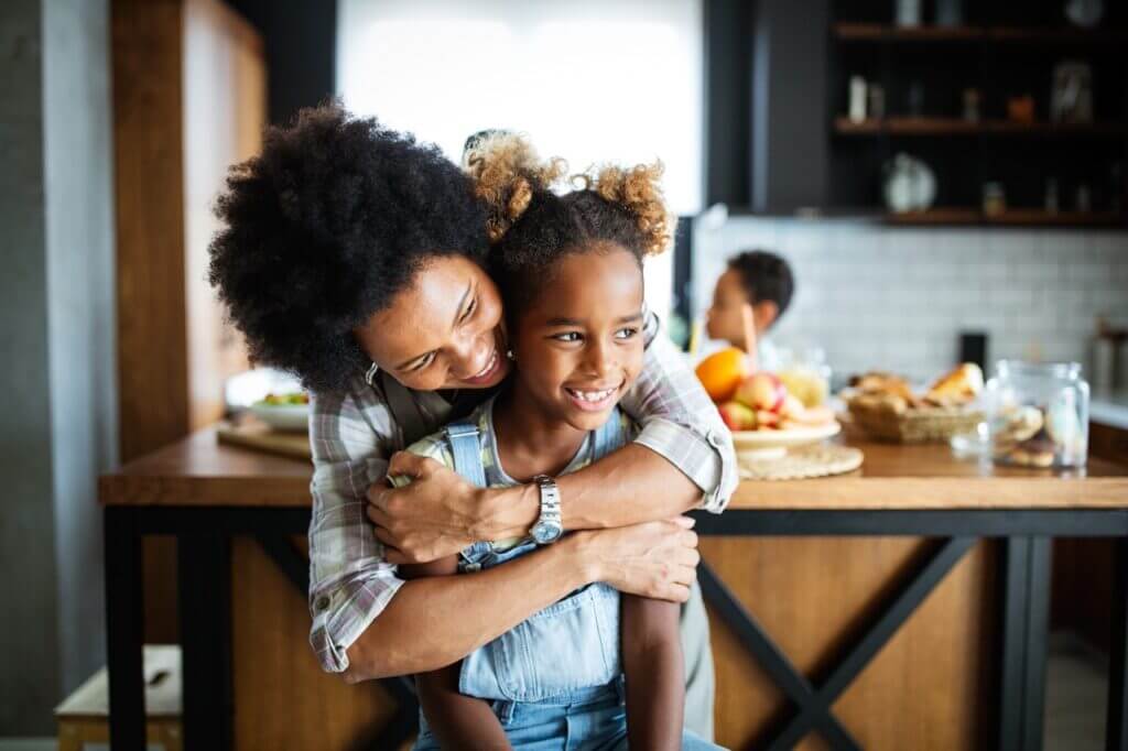 Mother and child discussing allergy management at home