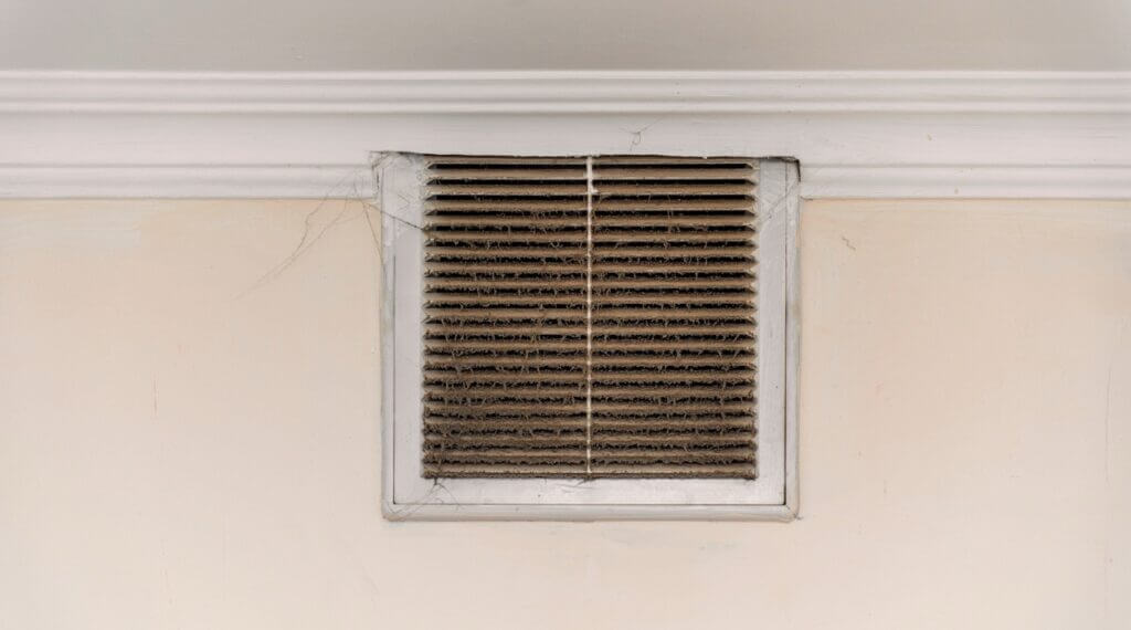 Dusty HVAC vent showing indoor allergens and dust buildup